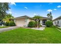 Single-story home with a well-maintained lawn and attached garage at 2907 Sunset Lakes Blvd, Kissimmee, FL 34747