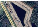 Aerial view showcasing a waterfront community with roads and lots at 4350 Sagefield Dr, St Cloud, FL 34773