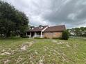 Brick ranch home with covered porch at 6891 Old Melbourne Hwy, Saint Cloud, FL 34771