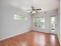 Bright living room with wood flooring and access to balcony at 4316 S Kirkman Rd # 1602, Orlando, FL 32811