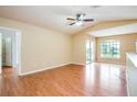 Spacious living room with laminate flooring and sliding doors at 4316 S Kirkman Rd # 1602, Orlando, FL 32811