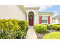 Single-Gathering home with red shutters and a welcoming entrance at 441 Montara Dr, Davenport, FL 33897