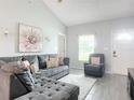 Living room with L-shaped sofa and neutral decor at 1092 Providence Blvd, Deltona, FL 32725