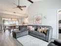 Spacious living room with L-shaped sectional sofa and large TV at 1092 Providence Blvd, Deltona, FL 32725