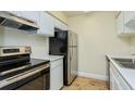 Clean and efficient kitchen featuring stainless steel appliances at 4806 S Semoran Blvd # 201, Orlando, FL 32822