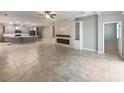 Spacious living room featuring a fireplace and an open floor plan at 5408 Manchester Dr, St Cloud, FL 34771