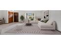 Bright living room with comfortable seating and stylish rug at 3472 Country Walk Dr, Port Orange, FL 32129
