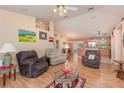 Open living room with hardwood floors and view into kitchen at 715 Unabelle Ave, Daytona Beach, FL 32117