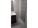 Clean bathroom with shower and gray floor at 2316 Twin Flower Ln, Sanford, FL 32771