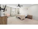 Spacious bedroom with carpeted floors and neutral decor at 1820 Holden Ridge Ln, Clermont, FL 34715