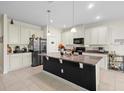 Modern kitchen with granite countertops and large island at 1820 Holden Ridge Ln, Clermont, FL 34715