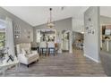 Bright living room featuring hardwood floors and kitchen views at 1641 Hallcrest Dr, Deltona, FL 32725