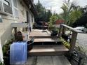 Wooden deck with stairs leading to the yard at 1117 E Hubbard Ave, Deland, FL 32724