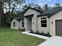 Modern home exterior with stone accents and landscaping at 1420 Lake Harney Rd, Geneva, FL 32732