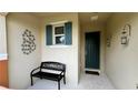 Inviting entryway with a bench and decorative wall art at 3167 Tocoa Cir, Kissimmee, FL 34746