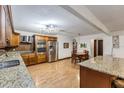 Kitchen features granite countertops and stainless steel appliances at 20319 Macon Pkwy, Orlando, FL 32833