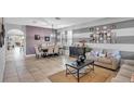 Bright living room with sofa, coffee table, and access to dining area at 1890 Altavista Cir, Lakeland, FL 33810