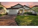 Two-story house with brick driveway at 1890 Altavista Cir, Lakeland, FL 33810