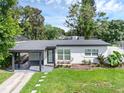 Newly renovated home with carport and landscaped front yard at 1711 White Ave, Orlando, FL 32806