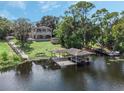 Lakefront home with dock and boathouse at 7600 Lake Marsha Dr, Orlando, FL 32819