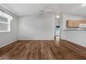 Bright living room featuring wood flooring and neutral walls at 17479 Se 82Nd Pecan Ter, The Villages, FL 32162