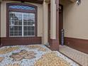 Welcoming front entry with stone and landscaping at 143 Brunswick Dr, Davenport, FL 33837