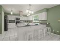 Spacious kitchen with island and modern appliances at 2101 Appy Ln, Apopka, FL 32712