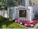 Inviting entrance to Lakeside at Delaney Park Condominium, featuring landscaping and signage at 1100 Delaney Ave # F203, Orlando, FL 32806