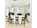 Kitchen with breakfast bar and white cabinets at 1138 Knollwood Dr, Davenport, FL 33837