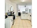 Kitchen with island and stainless steel appliances at 1138 Knollwood Dr, Davenport, FL 33837