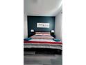Bedroom with king-size bed and dark-blue accent wall at 1138 Knollwood Dr, Davenport, FL 33837