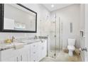 Elegant bathroom with double vanity, large mirror, and a walk-in shower at 900 Sussex Close, Orlando, FL 32804