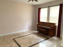 Spacious living room with hardwood floors and large windows at 963 N Jacks Lake Rd, Clermont, FL 34711