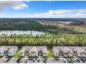 Aerial view of a residential community with a lake nearby at 2051 Royal Bay Blvd # 13, Kissimmee, FL 34746