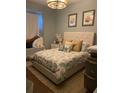 Main bedroom with coastal bedding and built-in window seat at 8208 Vineland Oaks Blvd, Orlando, FL 32835