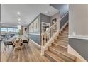 Modern staircase with wood steps and white railing in a spacious home at 2210 Lelani Cir, Davenport, FL 33897