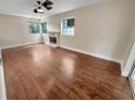 Spacious living room with hardwood floors and fireplace at 910 Alameda Dr, Longwood, FL 32750