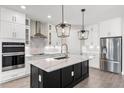 Modern kitchen with stainless steel appliances and an island at 2141 Divot Drive Dr, Daytona Beach, FL 32124
