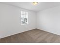 Bright bedroom with neutral-toned carpet and large window at 3174 Viceroy Ct, Poinciana, FL 34759