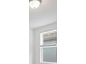 Bright bedroom with window, blinds, and ceiling light at 3170 Viceroy Ct, Poinciana, FL 34759