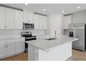 Modern kitchen with white cabinets and quartz countertops at 3162 Viceroy Ct, Poinciana, FL 34759