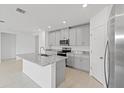 Modern kitchen featuring granite countertops and stainless steel appliances at 3150 Viceroy Ct, Poinciana, FL 34759