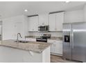 Modern kitchen with stainless steel appliances and granite countertops at 3551 Broadwing Blvd, Poinciana, FL 34759