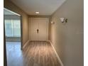 Light and bright entryway with double doors and wood flooring at 2406 W Orange Blvd, Kissimmee, FL 34741