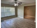 Spacious living room with large window and wood flooring at 2406 W Orange Blvd, Kissimmee, FL 34741
