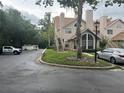 Townhome exterior with landscaping and parking at 575 Bloomington Ct # 27, Altamonte Springs, FL 32714