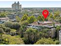 Aerial view of a residential building marked by a red pin at 7651 Whisper Way # 401, Reunion, FL 34747