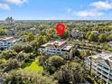 Aerial view of a residential building marked by a red pin at 7651 Whisper Way # 401, Reunion, FL 34747