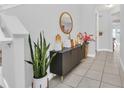 Bright entryway with console table and decor at 2599 Nouveau Way, Kissimmee, FL 34741