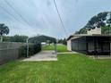 Large backyard with carport and home's back exterior at 2815 N Leavitt Ave, Orange City, FL 32763